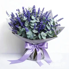 Wrapped bouquet of lavender flowers with purple ribbon © DAHLIA