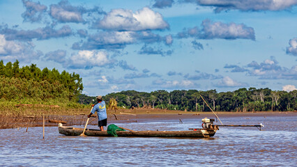 Fototapeta premium People fishing on the Beni River in the Amazon Basin near Rurrenabaque, Bolivia