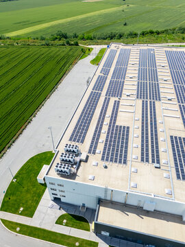 Roof of an industrial building with solar panels on the roof