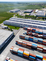 Obraz premium Aerial view of a modern logistics center with solar panels on the roof