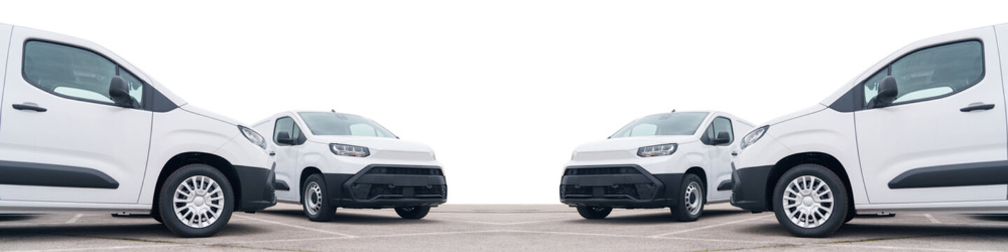 White delivery vans are parked in rows. Commercial fleet of vehicles