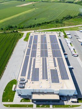 Roof of an industrial building with solar panels on the roof