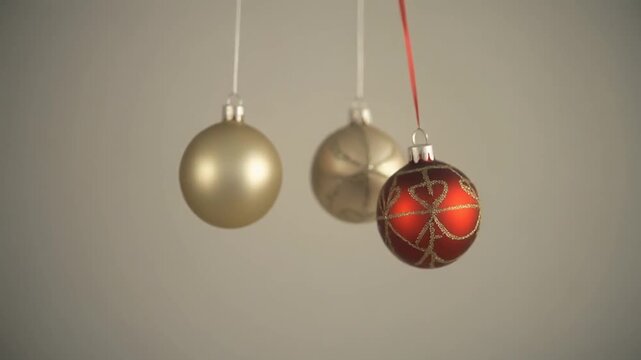 Elegant Christmas Ornaments Hanging as Newton Cradle Pendulum Balls for Festive Holiday Decoration and Seasonal Celebration Concept