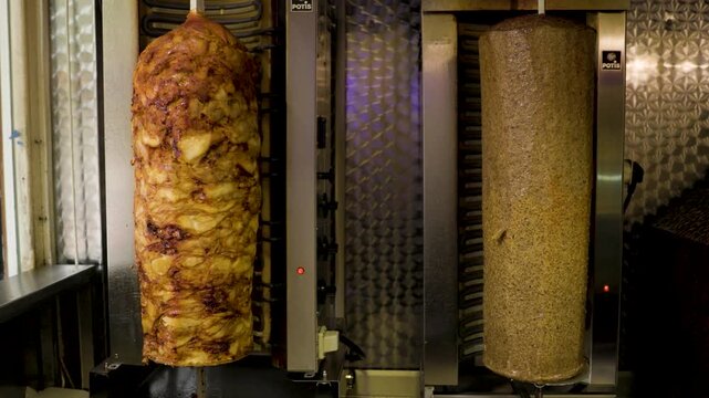 Shawarma Meat Rotating On Vertical Spit In Takeaway Shop