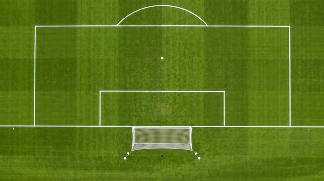 Aerial View of Empty Soccer Football Field Goal Area.