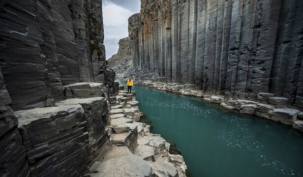 Tourist at Stu&eth;lagil Canyon, basalt columns, Egilsstadir, Iceland