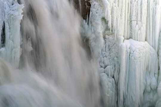 Close-up of a waterfall with frozen structures and flowing water, winter, Sweden's highest waterfall, T&auml;nnforsen, &Aring;re&auml;lven, Are, J&auml;mtland, Sweden