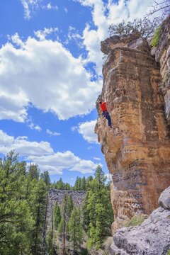 Man rock climbing at The Pit in Sandy's Canyon, Flagstaff, Arizona, USA