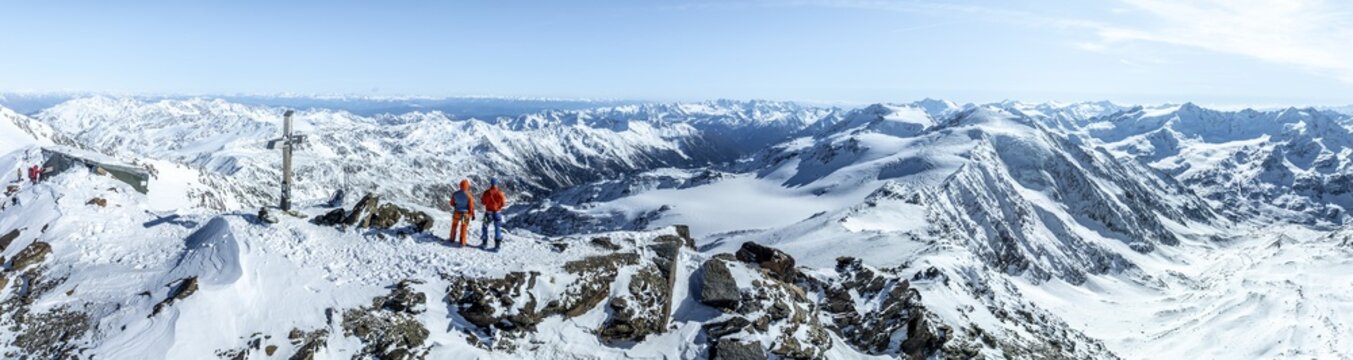 Two ski tourers on the summit of Cevedale, Alpine panorama, Aerial view, Snow-covered mountain landscape, Ortler group, Trento, Italy