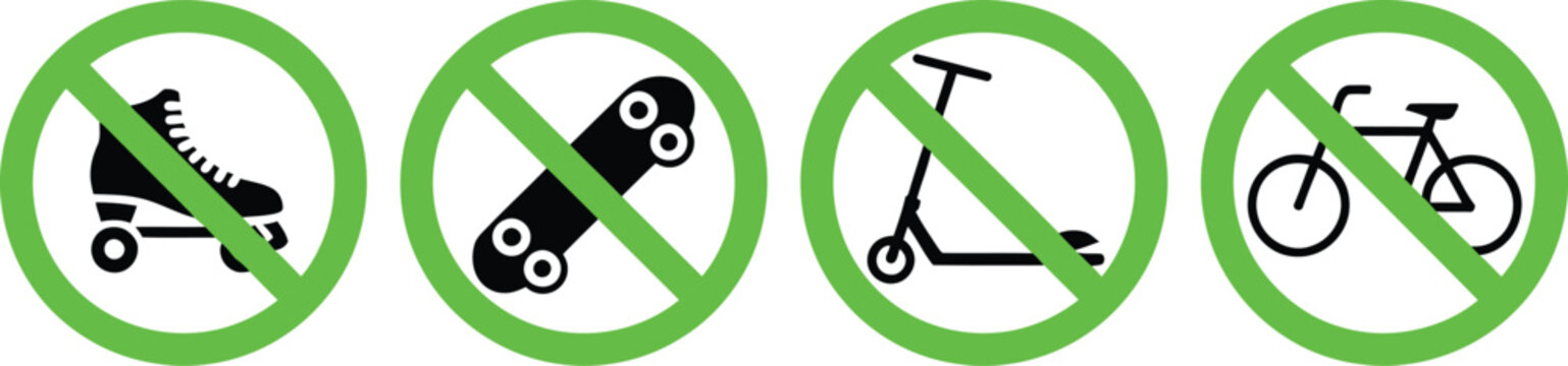 Set of four green circular prohibition signs showing no roller skating skateboarding kick scootering and cycling allowed in this area