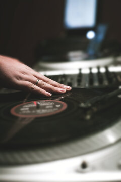 Night party with scratch dj playing vinyl