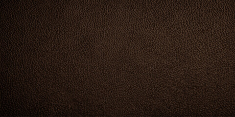 Fototapeta premium A close-up of rich, dark brown leather texture, showcasing its natural grain and subtle sheen, suggesting luxury and durability.