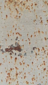 Vertical Corroded Metal sheet showing extensive brown rust damage. Use for abandoned factory aesthetics, steampunk concepts, and heavy urban textures.