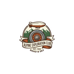 Vintage Alpine Exploration Club Badge Combining A Zeppelin, Rugged Mountains, Classic Car Wheel And Ribbon Banner, Suited For Heritage Outdoor Gear Packaging And Vector Illustration © bibit