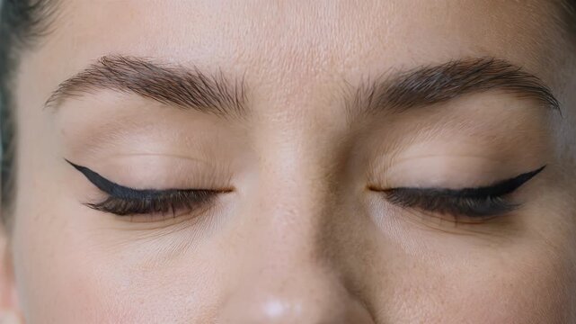 Eyeliner, makeup eyes and beauty in studio for cosmetics, skincare and wellness. Young woman, green eye and lashes with eyeliner wing for fashion, face portrait and attractive look for girl styled