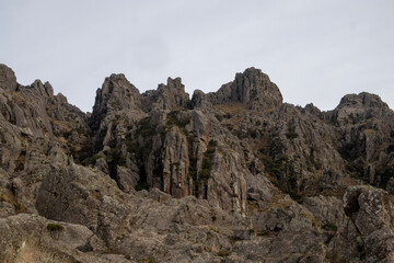 Fototapeta premium Dramatic grey rock formations in a rugged mountain landscape