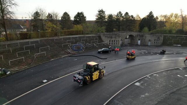 Top view of industrial machinery laying asphalt