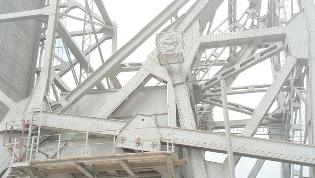 Industrial steel bridge structure with riveted metal framework