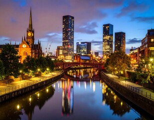 Obraz premium A scenic cityscape at dusk, featuring a river reflecting lit buildings and a historic church with a prominent spire