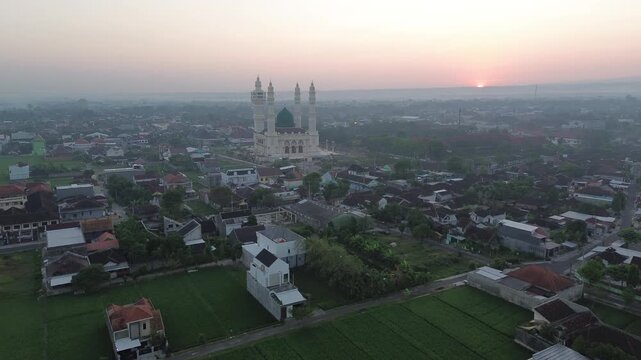 Aerial Sunrise View of Madaniyah Mosque and Mount Lawu in Karanganyar, Central Java, Indonesia