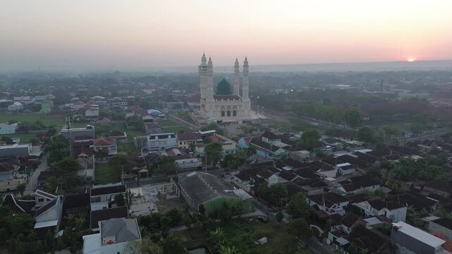Aerial Sunrise View of Madaniyah Mosque and Mount Lawu in Karanganyar, Central Java, Indonesia