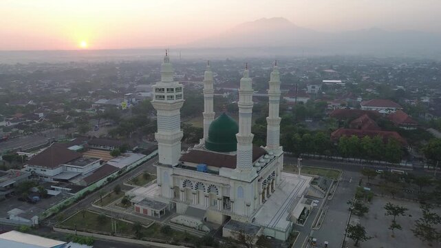 Aerial Sunrise View of Madaniyah Mosque and Mount Lawu in Karanganyar, Central Java, Indonesia