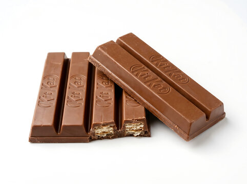 Kit kat chocolate bars stacked and broken studio lighting