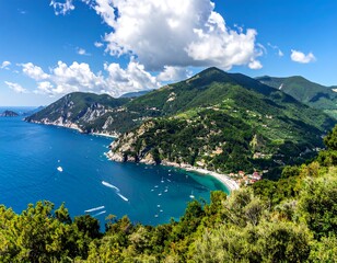 Fototapeta premium A scenic coastal view showcasing turquoise waters, lush green hills, a small beach, and a vibrant blue sky with fluffy clouds