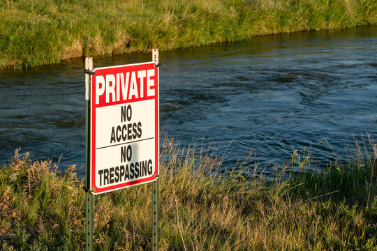 private, no access, no trespassing - sign against water diversion canal in northern Colorado