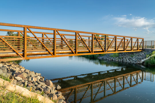 biking trail crossing water diversion canal - Poudre River Trail near Timnath in northern Colorado