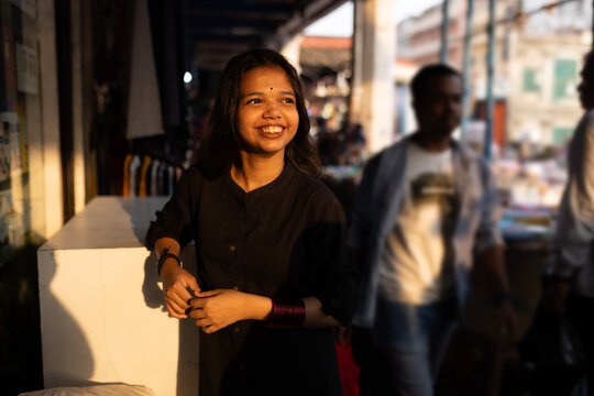 Portrait of a young woman in a city
