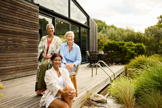 Friends Enjoy Time Together by the House