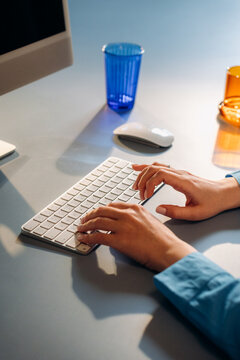 A woman uses a computer in the office