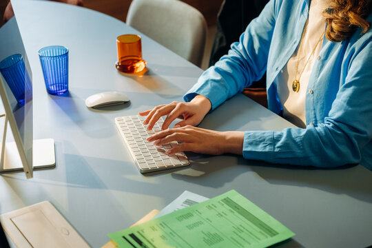 A woman uses a computer in the office