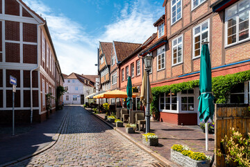 Fototapeta premium Stade, Germany, picturesque old town street with traditional buildings, cafes and summer atmosphere
