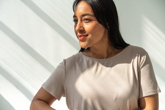 Confident Brunette Woman Portrait Smiling in Natural Sunlight