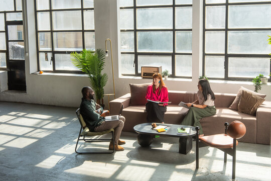 Creative Team Having A Business Meeting In A Open Space Studio