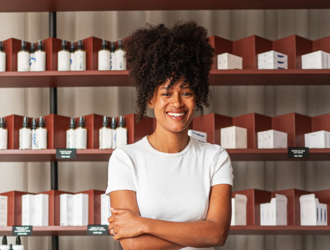 Confident Small Business Owner Smiling in Skincare Shop