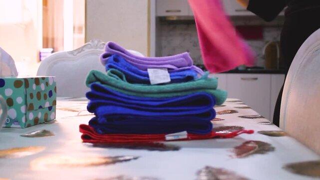 kitchen rags are folded into a stack after washing