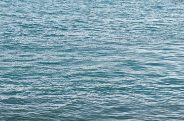 Obraz premium Sea wave. Blue waves under the summer sun. Close-up of the sea surface, natural background