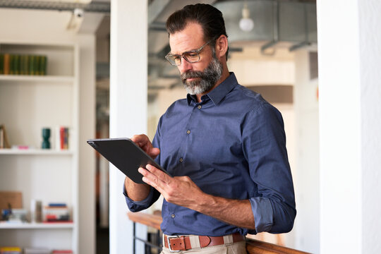 Businessman Using Tablet in Office