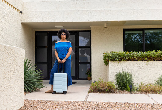 Black woman luggage Portrait home outdoors rideshare 