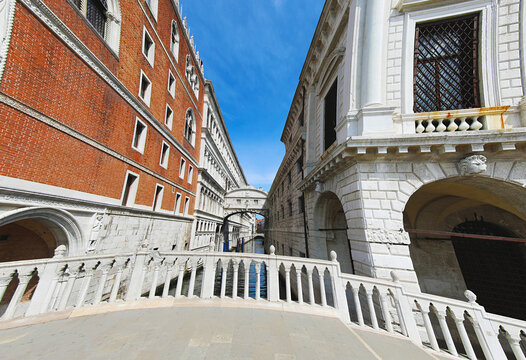 Bridge of Sighs and Doges Palace under blue sky in Venice Italy