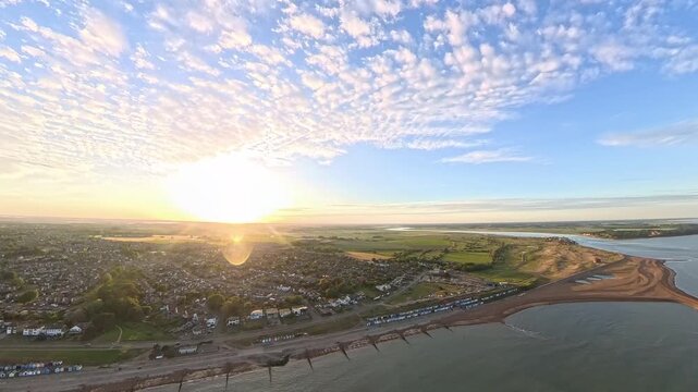 4K Drone Aerial View: Old Felixstowe Seafront and Shingle Beach at Golden Hour