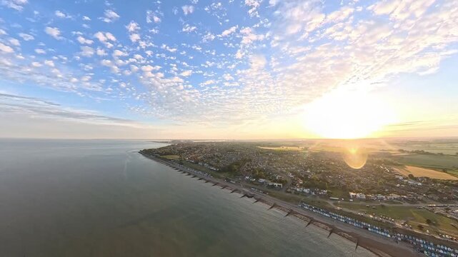 4K Drone Aerial View: Old Felixstowe Seafront and Shingle Beach at Golden Hour