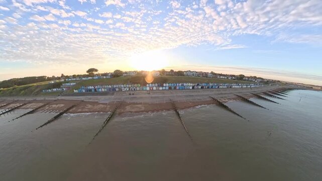 4K Drone Aerial View: Old Felixstowe Seafront and Shingle Beach at Golden Hour