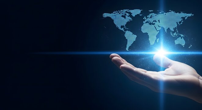 Human hand holding a glowing digital world map and bright light beam on a dark background