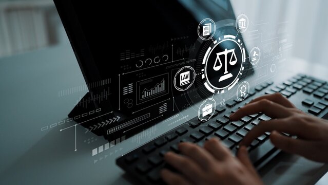 Hands Typing on Keyboard with Digital Justice and Law Icons Displayed on Computer Screen in Modern Office Environment. Entropy.