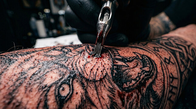 Artistic tattoo of a wolf on a person's arm.