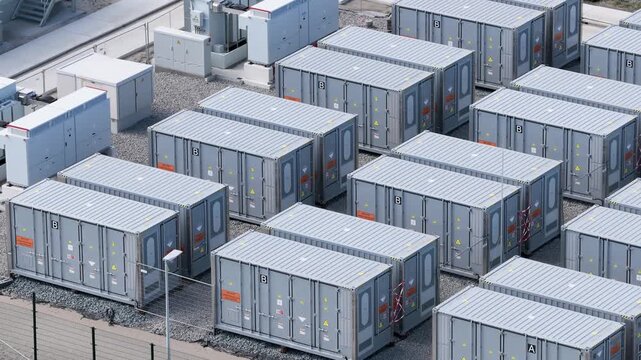 Aerial view on battery energy storage system for renewable power plant. Industrial lithium batteries facility for clean electricity grid management and sustainable technology infrastructure.